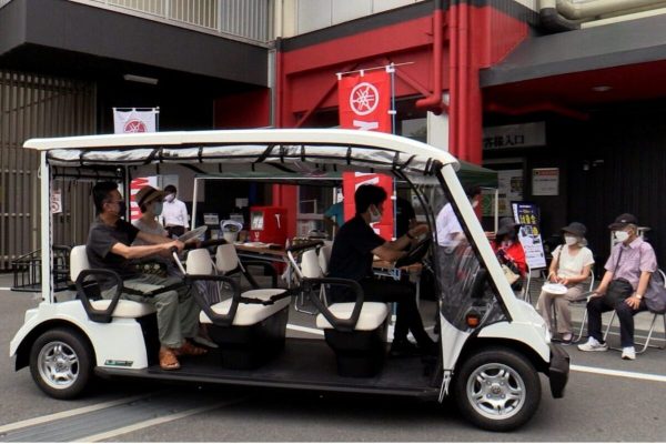An electric cart makes its rounds